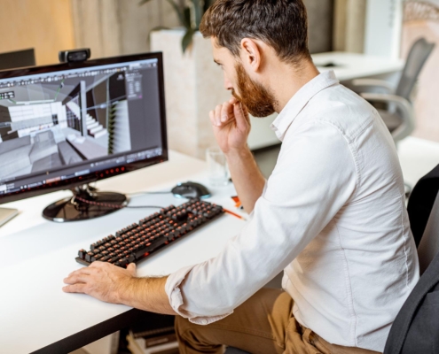 Engineer working on digital model of building