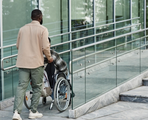 Person using wheelchair ramp